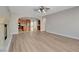 An open concept living room is shown with a fireplace and views into the kitchen area at 981 Buffalo River Ave, Henderson, NV 89002
