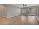 Bright and airy living room with light wood floors, slider to backyard, and neutral color palette at 981 Buffalo River Ave, Henderson, NV 89002