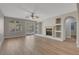 Spacious living room with a fireplace, built-in shelving, and sliding glass doors leading to the backyard at 981 Buffalo River Ave, Henderson, NV 89002