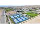 Aerial view showcases a Primary planned community with amenities including pickle ball courts and green spaces at 10049 Cardinal Knoll Ave, Las Vegas, NV 89143