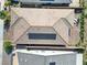 A detailed overhead shot showcasing a home's roof with solar panels, manicured landscape, and patio at 10049 Cardinal Knoll Ave, Las Vegas, NV 89143
