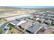 A high-angle view of a community featuring modern homes with well-maintained landscaping and paved streets at 10049 Cardinal Knoll Ave, Las Vegas, NV 89143