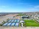 Aerial view of a Primary planned community with pickle ball courts, community park, and modern clubhouse at 10049 Cardinal Knoll Ave, Las Vegas, NV 89143