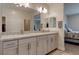 Bathroom featuring dual sinks, granite countertops and tile flooring at 10049 Cardinal Knoll Ave, Las Vegas, NV 89143