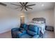 Inviting bedroom with bed, accent seating, and stylish decor creating a relaxing atmosphere at 10049 Cardinal Knoll Ave, Las Vegas, NV 89143
