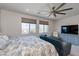 Bright bedroom boasts large windows, cozy seating area, and modern furnishings at 10049 Cardinal Knoll Ave, Las Vegas, NV 89143