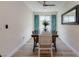 Dining room features a long table and decorative curtains to create a cozy atmosphere at 10049 Cardinal Knoll Ave, Las Vegas, NV 89143