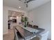 Open-concept dining room with wood table adjacent to a modern kitchen at 10049 Cardinal Knoll Ave, Las Vegas, NV 89143