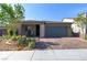 Beautiful single-story home with a two-car garage and a well-manicured, low-maintenance front yard at 10049 Cardinal Knoll Ave, Las Vegas, NV 89143