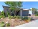 Charming single-story home with desert landscaping, a cozy porch, and a warm, inviting curb appeal at 10049 Cardinal Knoll Ave, Las Vegas, NV 89143