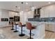 Spacious kitchen featuring granite counters, a stylish backsplash, and stainless steel appliances at 10049 Cardinal Knoll Ave, Las Vegas, NV 89143