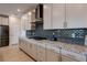 Modern kitchen design with granite countertops, stainless steel hood, and ample cabinet space at 10049 Cardinal Knoll Ave, Las Vegas, NV 89143