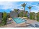 Relaxing pool area with desert landscaping, tanning deck, and privacy walls, offering a tranquil outdoor space at 10049 Cardinal Knoll Ave, Las Vegas, NV 89143
