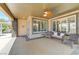 Charming back patio with seating, ceiling fan, and easy access to the home at 10237 Andante Ct, Las Vegas, NV 89135