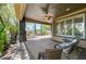 Relaxing covered patio overlooking beautifully landscaped backyard with lounge seating at 10237 Andante Ct, Las Vegas, NV 89135