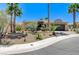 Single-story home with landscaped front yard, palm trees, and stone accents on a quiet street at 10237 Andante Ct, Las Vegas, NV 89135