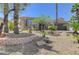 Desert landscaped single-story home with stone accents, mature palms, and a well-maintained front yard at 10237 Andante Ct, Las Vegas, NV 89135