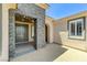 Inviting front entrance with stacked stone accents and a neutral color palette, under a clear blue sky at 10237 Andante Ct, Las Vegas, NV 89135