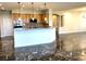 Elegant kitchen and living room with stainless appliances and marble floors at 10237 Andante Ct, Las Vegas, NV 89135
