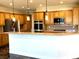 Bright and inviting kitchen with light wood cabinets and granite countertops at 10237 Andante Ct, Las Vegas, NV 89135