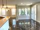 Open living space with marble floors, plantation shutters, and stylish lighting at 10237 Andante Ct, Las Vegas, NV 89135