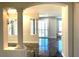 Bright living room featuring black marble flooring and column architecture at 10237 Andante Ct, Las Vegas, NV 89135