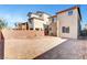 Large backyard featuring gravel, a block wall, and an outdoor dining set at 10735 Galveston Bay St, Las Vegas, NV 89179