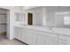 Bathroom featuring double vanity, tile flooring, and a large mirror for a luxurious feel at 10735 Galveston Bay St, Las Vegas, NV 89179