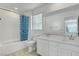 Bathroom features dual sinks, a tiled shower-tub combination, and modern fixtures at 10735 Galveston Bay St, Las Vegas, NV 89179