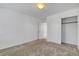 Bedroom features neutral carpeting, white walls, a closet, and easy access to the landing at 10735 Galveston Bay St, Las Vegas, NV 89179