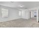 Spacious bedroom features neutral carpet and white trim, adjacent to the en suite bathroom at 10735 Galveston Bay St, Las Vegas, NV 89179