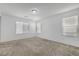 Bright bedroom with plush carpet and multiple windows allowing for natural light at 10735 Galveston Bay St, Las Vegas, NV 89179