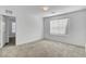 Bright bedroom with neutral carpet offers a glimpse into other rooms, enhancing the feeling of spaciousness at 10735 Galveston Bay St, Las Vegas, NV 89179
