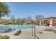 Community pool with lounge chairs and covered seating area for residents' enjoyment at 10735 Galveston Bay St, Las Vegas, NV 89179