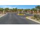 View of community entry gate with stone pillars and decorative metalwork at 10735 Galveston Bay St, Las Vegas, NV 89179