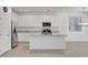 Bright kitchen with white cabinetry, stainless steel appliances, and granite countertops at 10735 Galveston Bay St, Las Vegas, NV 89179