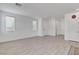 A bright living room boasts tile floors, natural light from the windows, and easy access to other rooms at 10735 Galveston Bay St, Las Vegas, NV 89179