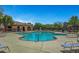 Community pool area with lounge chairs at 10735 Galveston Bay St, Las Vegas, NV 89179