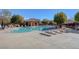 Resort-style pool with lounge chairs and a covered cabana area at 10735 Galveston Bay St, Las Vegas, NV 89179