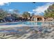 Beautiful community pool with lounging chairs, tables, and a cabana at 10735 Galveston Bay St, Las Vegas, NV 89179