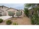 Single story home with desert landscaping, covered entry, and attached two-car garage at 10780 Valencia Hills St, Las Vegas, NV 89141