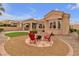 Inviting backyard with a stone fire pit surrounded by chairs, perfect for outdoor entertaining at 10801 Clarion Ln, Las Vegas, NV 89134