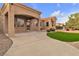 Charming backyard featuring manicured landscaping, a covered patio, and a cozy fire pit area at 10801 Clarion Ln, Las Vegas, NV 89134