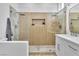 Bathroom with stand alone shower and double sinks with modern finishes at 10801 Clarion Ln, Las Vegas, NV 89134