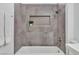 Stylish bathroom features a shower, a plant, and modern fixtures at 10801 Clarion Ln, Las Vegas, NV 89134