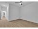 This bright bedroom features wood-look flooring and ample natural light from a window at 10801 Clarion Ln, Las Vegas, NV 89134