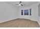 This bedroom boasts modern finishes, wood-look flooring, and ample natural light at 10801 Clarion Ln, Las Vegas, NV 89134
