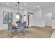 Dining room features a modern chandelier and view of entry area at 10801 Clarion Ln, Las Vegas, NV 89134