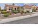 Well-maintained home with attractive landscaping and a neatly manicured front yard at 10801 Clarion Ln, Las Vegas, NV 89134
