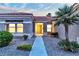 Inviting front entrance with well-maintained landscaping, stone accents, and a charming walkway at 10801 Clarion Ln, Las Vegas, NV 89134